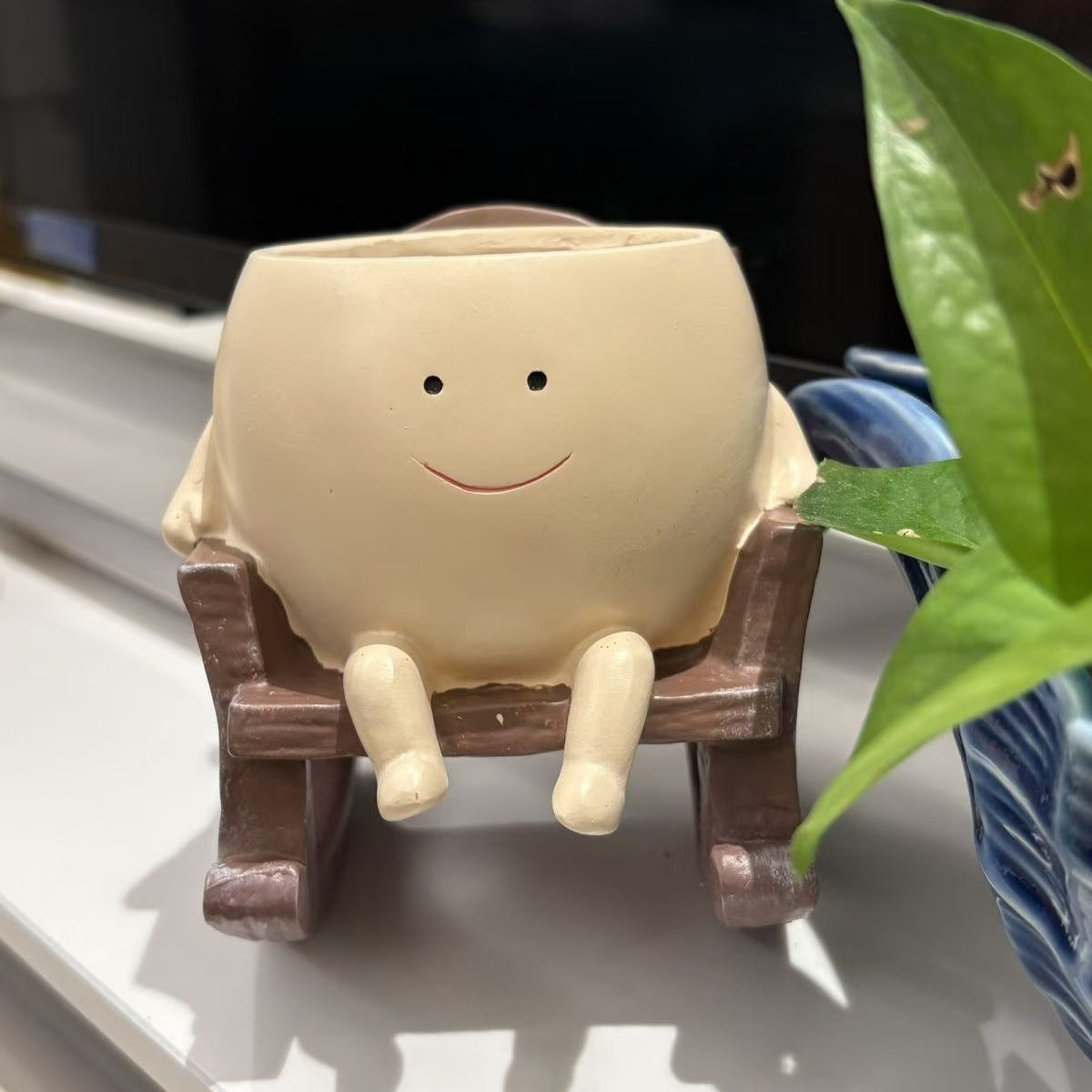 Smiley face rocking chair shaped resin flower pot
