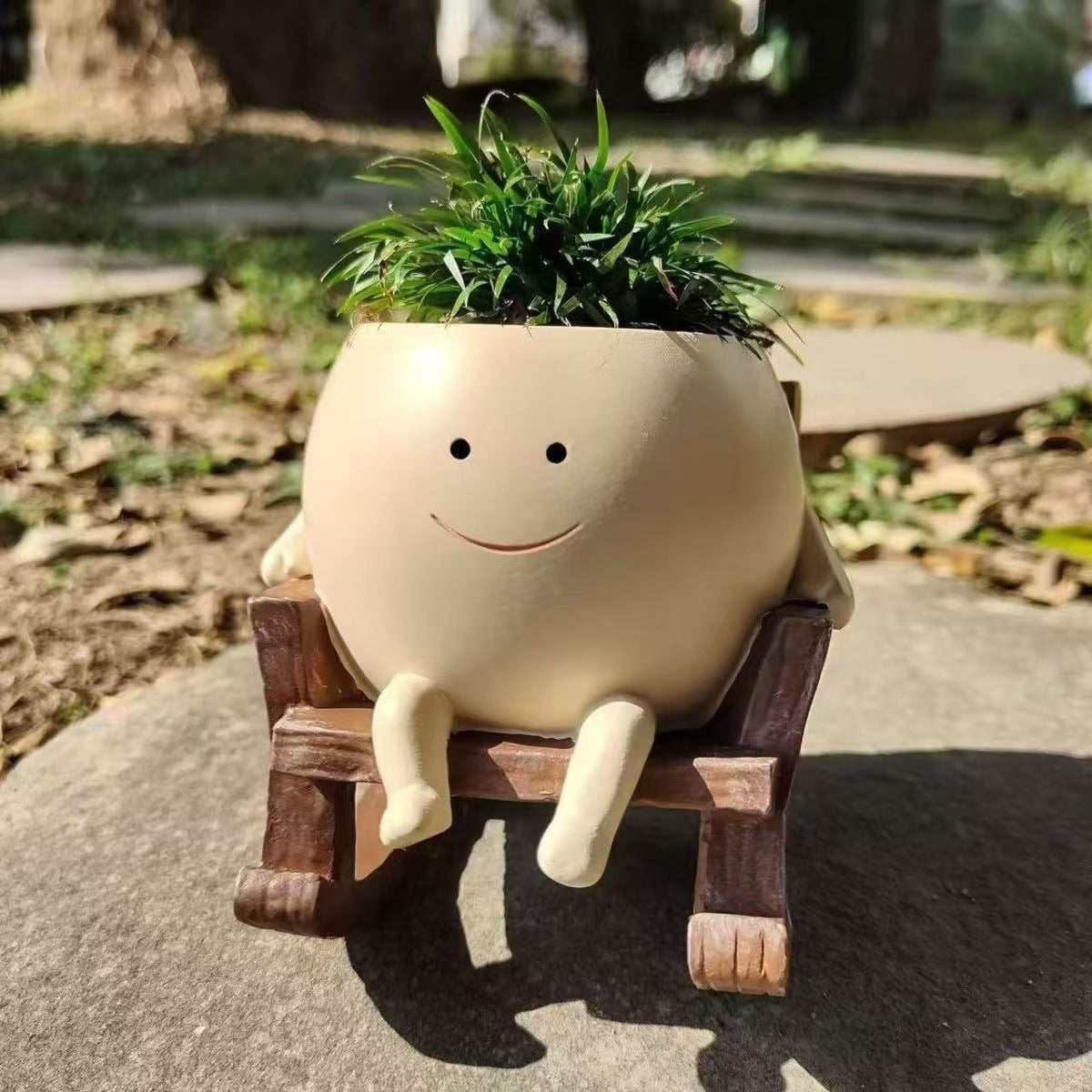 Smiley face rocking chair shaped resin flower pot