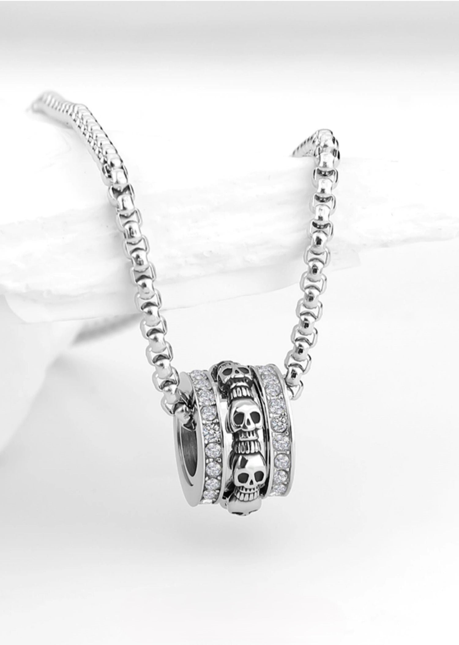 Rotatable skull necklace