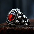 Red round gemstone skull ring
